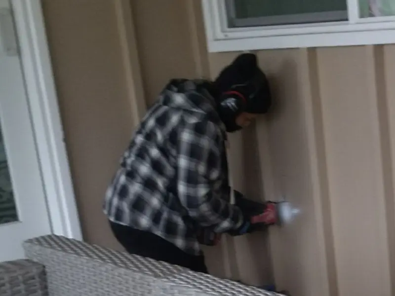Professional electrician installing an exterior outlet in Brunswick