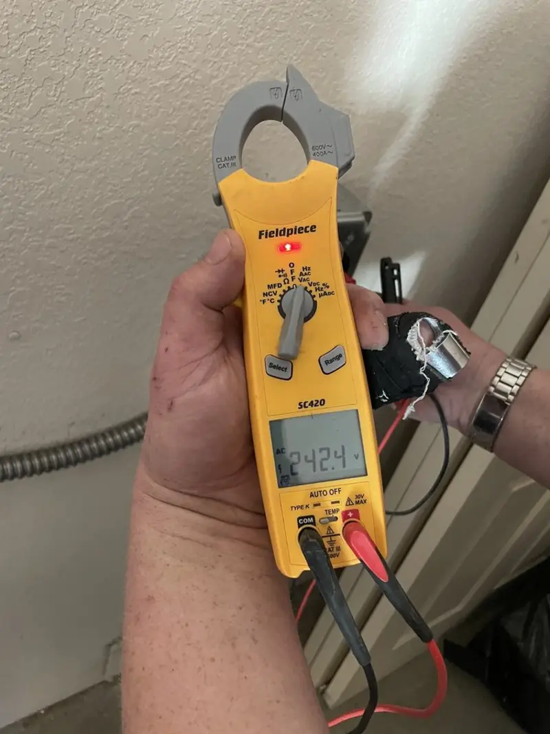 Voltage testing with clamp meter during Hot Tub / Pool Electrical Wiring in Brunswick